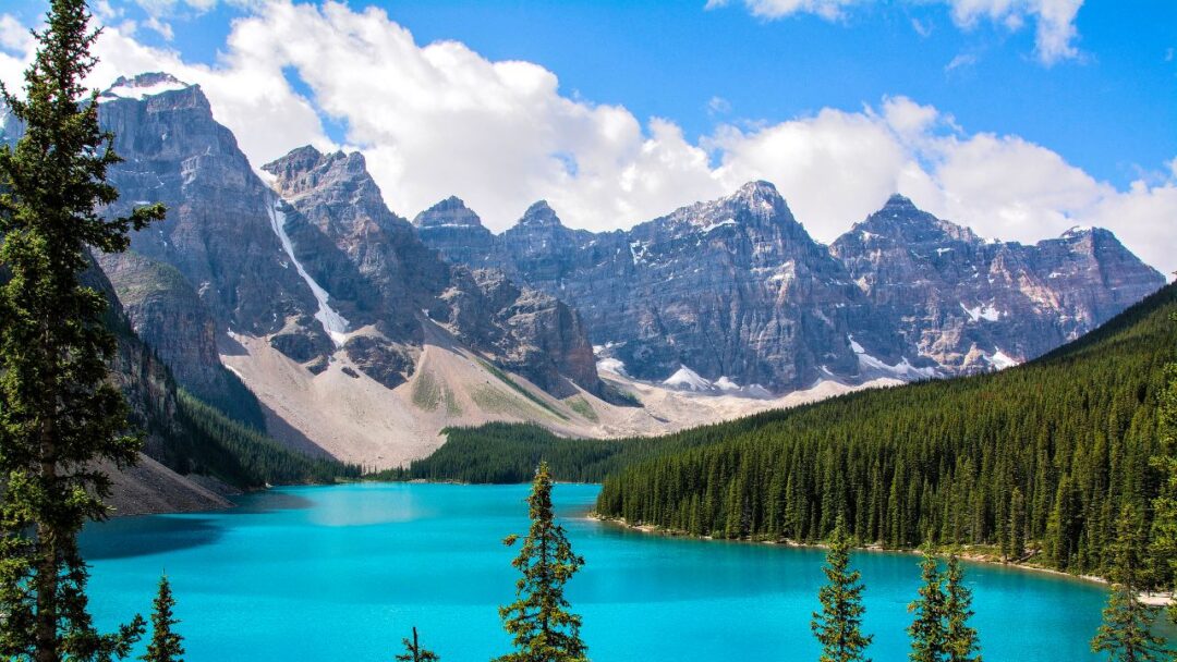 Scenic view of Banff National Park, Canada, with majestic mountains, crystal-clear lakes, and lush forests. 10 Most Beautiful National Parks Around the World.