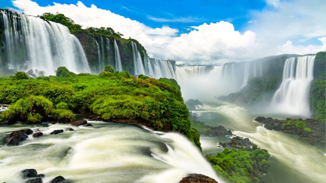 A breathtaking view of Iguazu Falls, located on the border between Argentina and Brazil. Top 10 Spectacular Waterfalls to Visit.