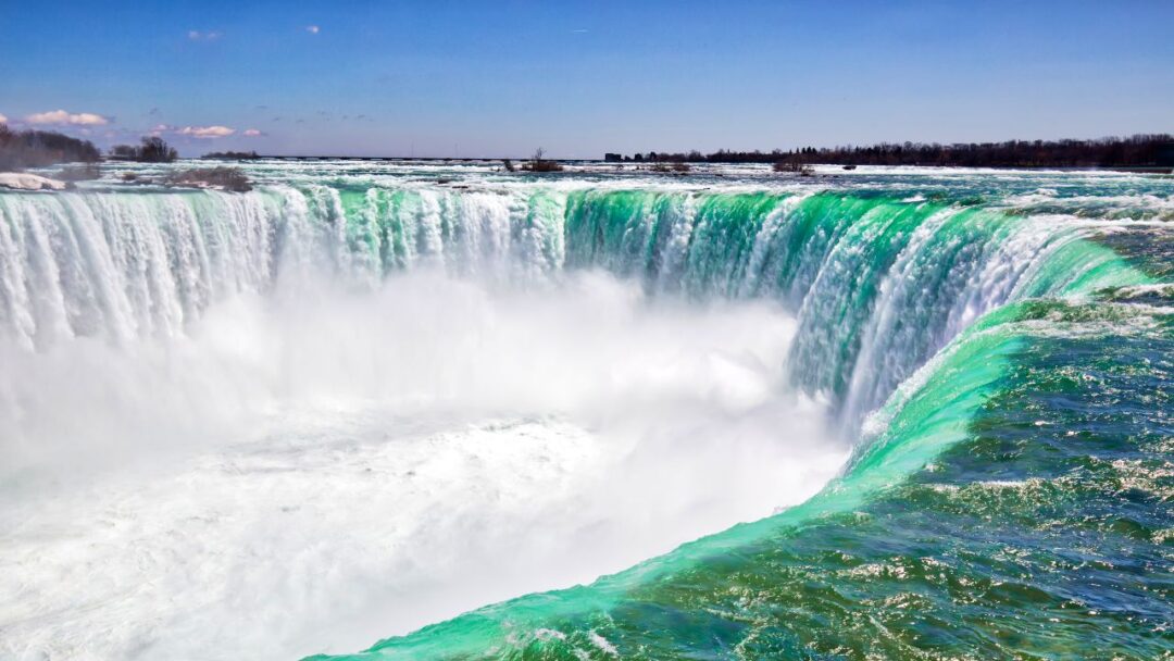 A breathtaking view of Niagara Falls, a powerful and majestic waterfall on the border of USA and Canada. Top 10 Spectacular Waterfalls to Visit.