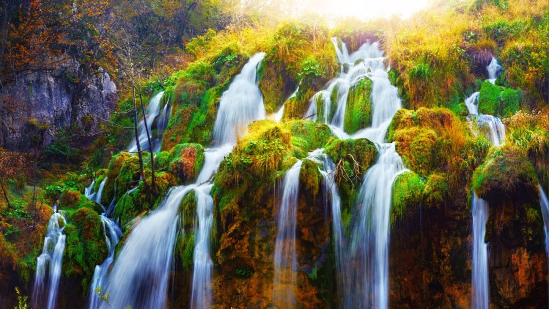 A serene view of Plitvice Lake National Park, Croatia, showcasing its breathtaking turquoise lakes and lush greenery. 10 Most Beautiful National Parks Around the World.