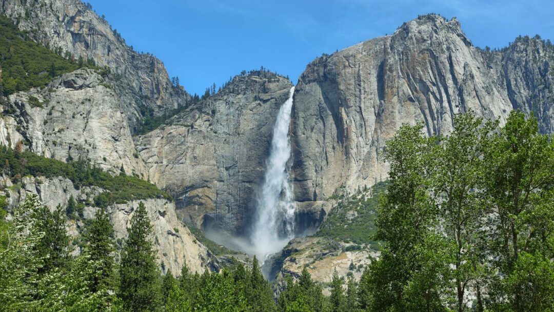 Breathtaking view of Yosemite Falls, USA – A majestic cascade of water surrounded by lush greenery and towering cliffs. Top 10 Spectacular Waterfalls to Visit.